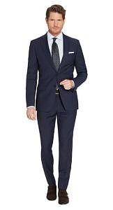 Pak donkerblauw geruit Ellis, €399,95 bij Van Gils